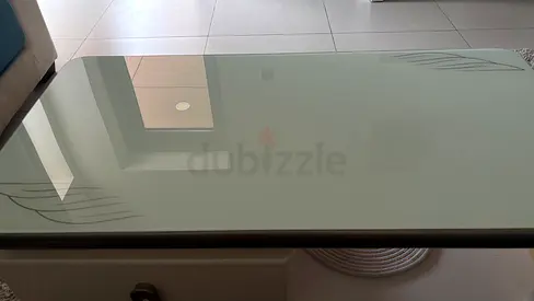 Glass top coffee table with decorative leaf etching - good condition