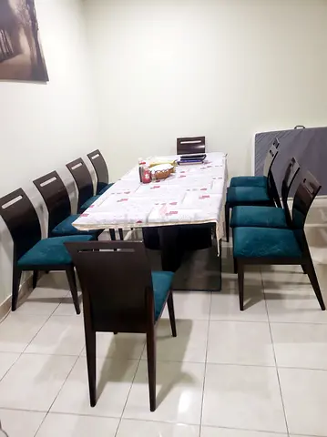 Wooden 8-Seater Dining Table with Upholstered Chairs - Good Condition