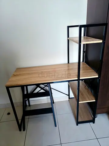 Compact wooden study desk with built-in shelving - good condition