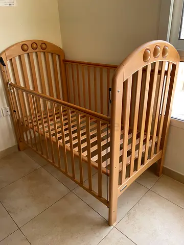 Solid wooden baby crib - natural finish, good condition