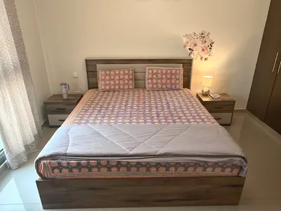 Double bed frame with mattress and two bedside tables and a chest drawer with mirror- good condition