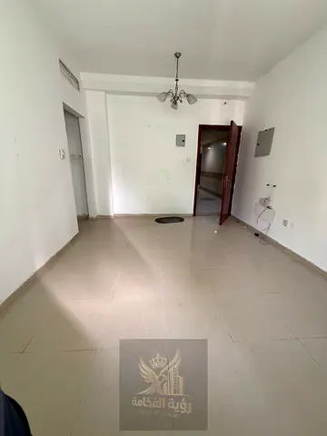 For Annual Rent: One-bedroom apartment with a living room in Al Khan, Sharjah, located behind Afamia and Yasmeen Contract.