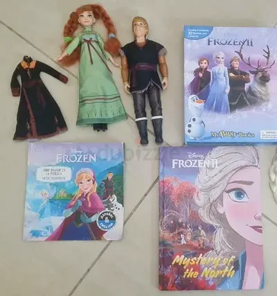 Anna and Kristoff figures and frozen 1 and 2 movie story books and my busy book