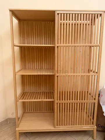 IKEA wooden shoe/storage cabinet with slatted doors — good condition