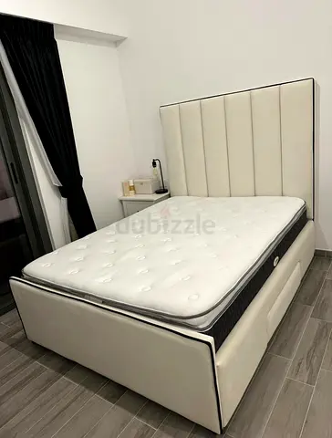 Queen upholstered bed frame with mattress - cream, good condition