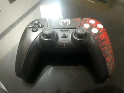 Used PS5 DualSense controller with custom Spider design - working condition
