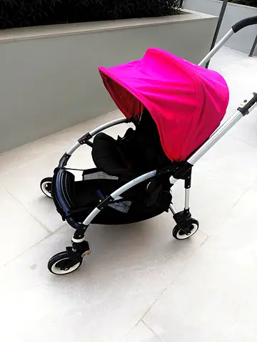 Lightweight pink canopy stroller in good condition