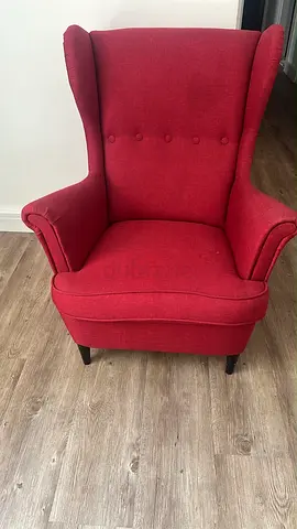 Red wingback armchair in good used condition. Ikea. Upholstery just changed few months ago.