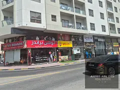 Residential & commercial building for sale in Al Nuaimiya 1, Ajman, corner location, AED 1.8M annual