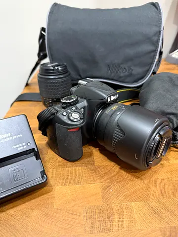 Nikon D3100 with extra zoom lense, case, charger