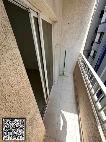 Unfurnished one-bedroom apartment (bedroom and living room) for monthly rent in Ajman; no cheques or attestations required.