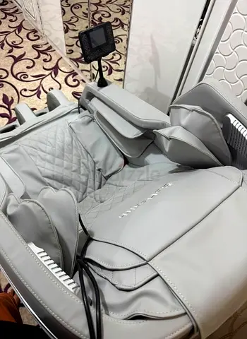 Used full-body massage chair in light grey - good condition