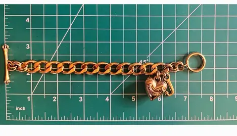 Gold-tone curb link charm bracelet with heart lock charm