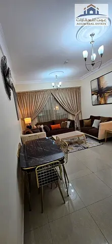 Super-class furnished 2-bedroom apartment with a living room in the Al Qasimia/Mega Mall area.