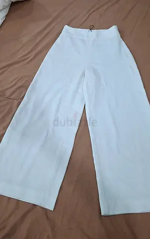 White wide-leg women's trousers, size approx XS - good condition