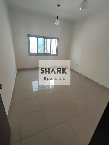 Spacious 3BR in Al Rashidiya 1, Ajman. Balcony, 2 bathrooms & central AC. AED 46K/year, payable in 4 or 6 installments. Cheque deposit.