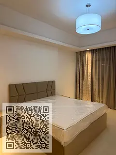 One-bedroom apartment with a living room for sale in Gulf Tower, Al Rashidiya 1.