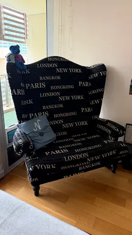 High-back fabric accent chair with city-print cover — good condition