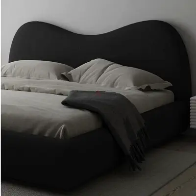 Modern upholstered double bed with curved headboard (dark grey)