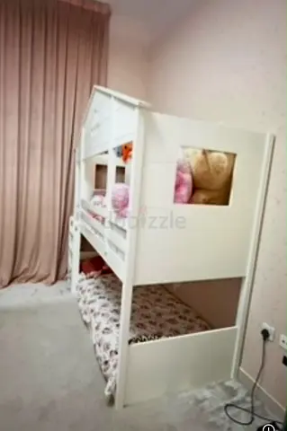 White wooden bunk bed for kids - sturdy twin/twin house-style frame