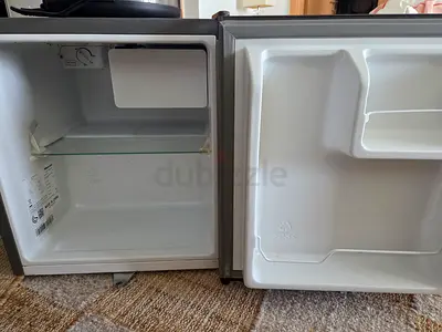 Small single-door mini fridge in good working condition