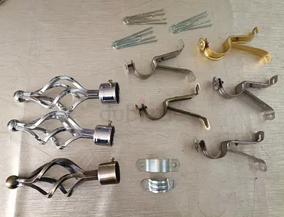 Set of metal curtain rod finials and brackets and curtain accessories