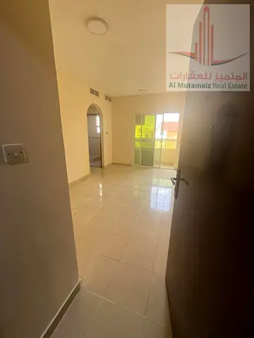 A 1-bedroom apartment is available for annual rent in a prime location in Al Nuaimiya 2, Ajman. The