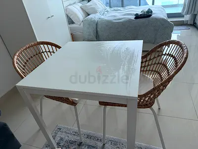 Ikea small white dining table with 2 rattan chairs - good condition