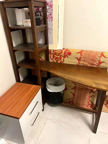 Wooden corner desk with built-in shelving - good condition
