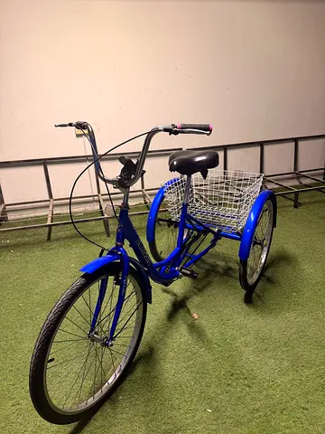 Blue adult three-wheel tricycle with front basket - good condition