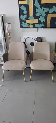 Pair of modern beige accent chairs with gold legs - 06 months old