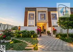 Townhouse for sale in Ajman, Al Zahiyah area. 4 bedrooms, majlis, 2 living rooms, and maid's room. F