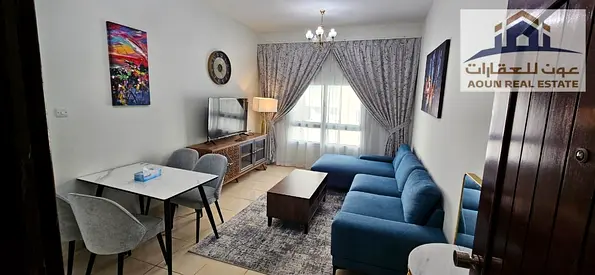 Furnished one-bedroom apartment with a living room in Al Majaz 3; hotel-style furnishing.