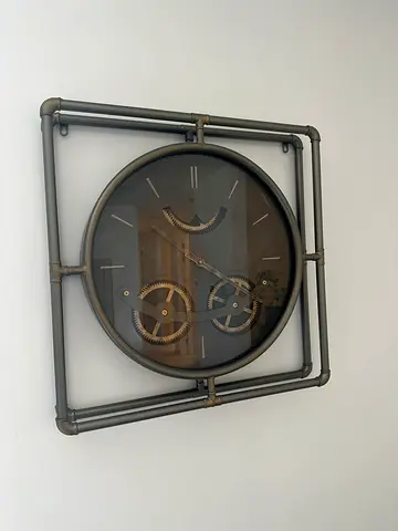 Industrial-style wall clock with visible gears