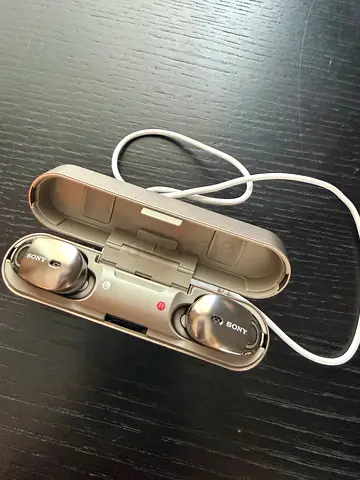 Sony wireless noise-cancelling earbuds with charging case (brand new)