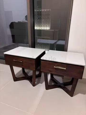 Pair of wooden bedside tables with marble tops. Solid wood. Crack on one table