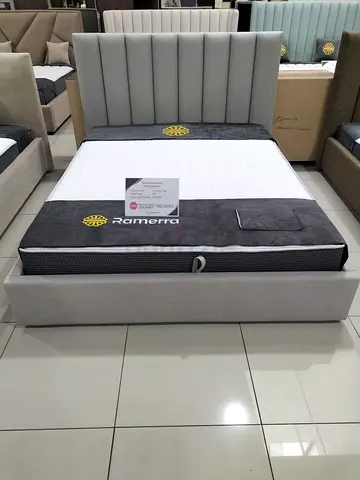Queen upholstered bed frame with tall padded headboard