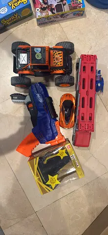 Mixed kids toy bundle: remote car, Nerf-style blaster, racer and accessories