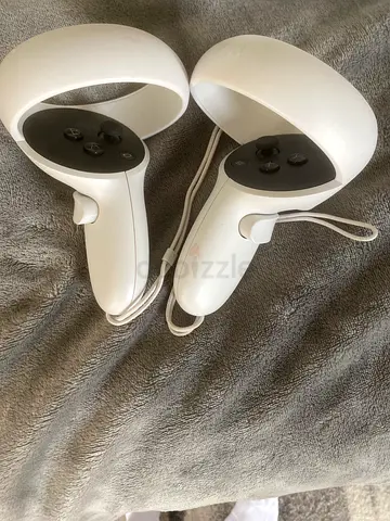 Meta Quest 2 (or similar) VR headset with two controllers and charger - used