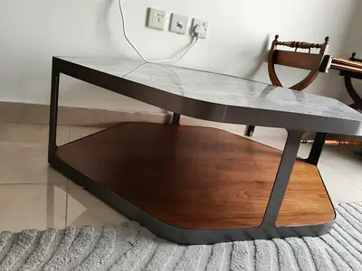 Modern two-tier coffee table with faux marble top and wooden shelf