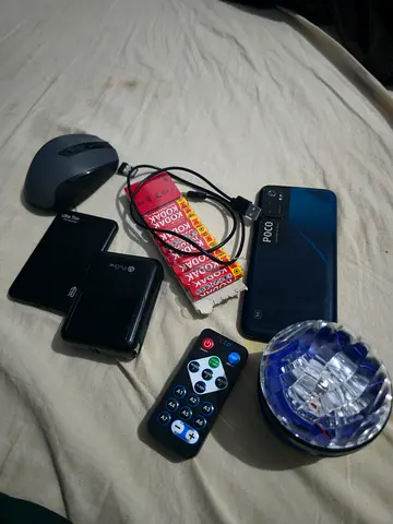 Complete Tech Electronics Bundle – POCO 5G Phone, 2x Power Banks, Mouse, Light & Batteries