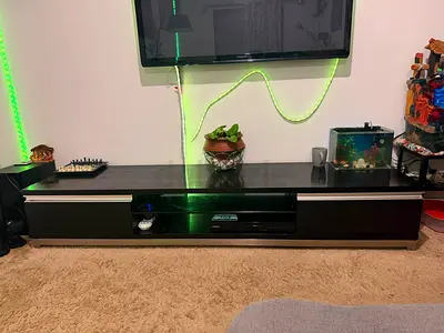 Low modern TV unit/entertainment cabinet in dark wood finish