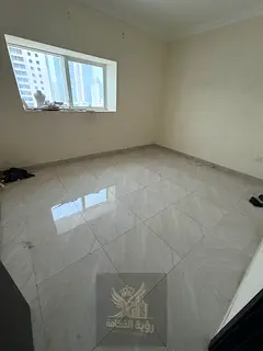 For annual rent in Al Majaz 2, Sharjah, a spacious two-bedroom apartment with a living room, offerin