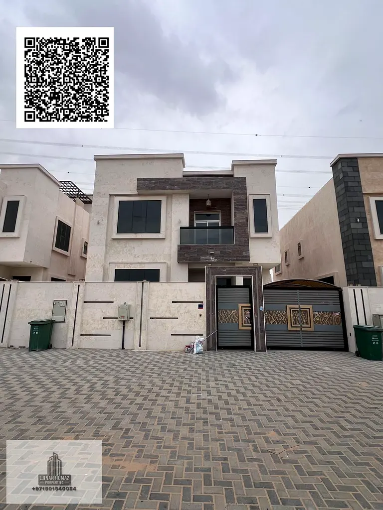 Villa for rent in Ajman, Al yasamin area. Ground floor, first floor, and . 5 master bedrooms with built-in wardrobes, equipped with electricity, w
