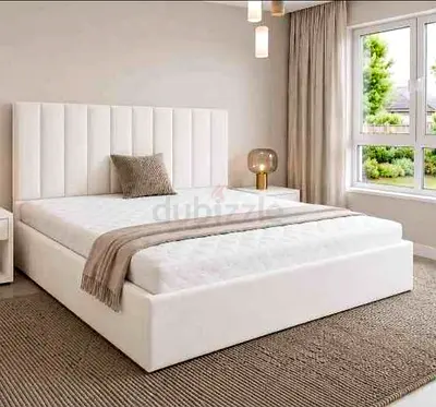New White upholstered king size bed frame with padded headboard
