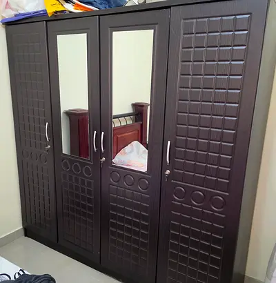 Spacious 4-Door Wardrobe with Mirrors and Texture Detail