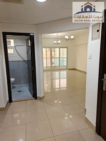 Excellent two-bedroom apartment with a living room and parking, in Al-Taawun.