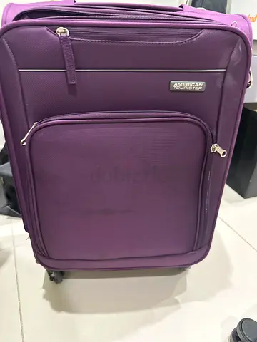 Purple American Tourister soft-shell suitcase, medium size, good condition