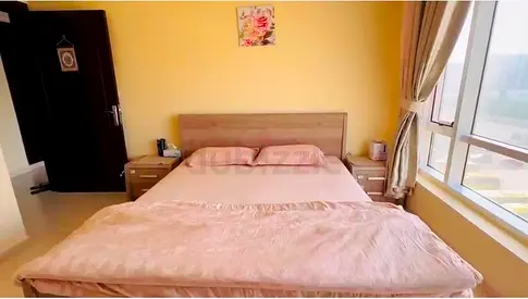 King size bed with matching nightstands - light wood finish