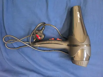 Compact black GW 3000W hair dryer in good working condition